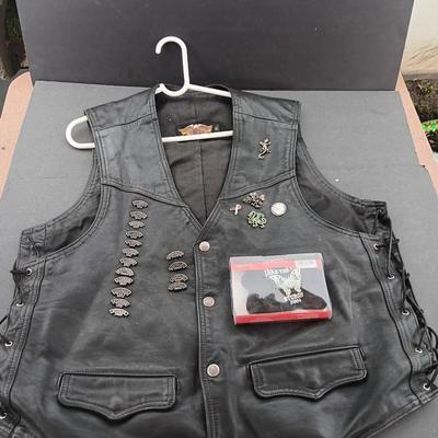 Harley Davidson Size XL Black leather biker vest with a nice collection of Sturgis pins