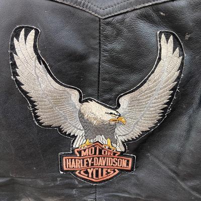 Harley Davidson Size XL Black leather biker vest with a nice collection of Sturgis pins