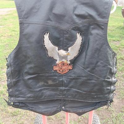 Harley Davidson Size XL Black leather biker vest with a nice collection of Sturgis pins