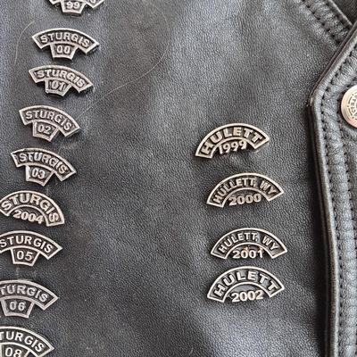 Harley Davidson Size XL Black leather biker vest with a nice collection of Sturgis pins