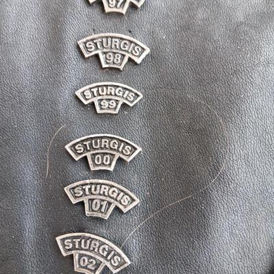 Harley Davidson Size XL Black leather biker vest with a nice collection of Sturgis pins