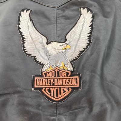 Harley Davidson Size XL Black leather biker vest with a nice collection of Sturgis pins