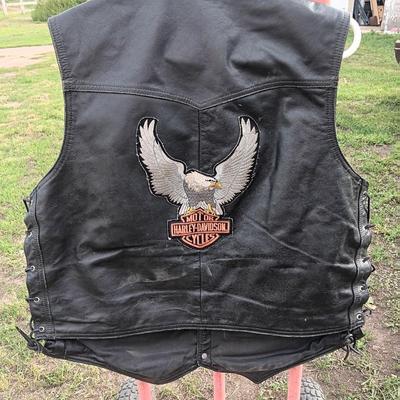 Harley Davidson Size XL Black leather biker vest with a nice collection of Sturgis pins