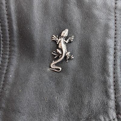 Harley Davidson Size XL Black leather biker vest with a nice collection of Sturgis pins