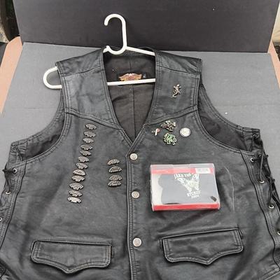 Harley Davidson Size XL Black leather biker vest with a nice collection of Sturgis pins
