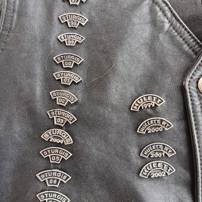 Harley Davidson Size XL Black leather biker vest with a nice collection of Sturgis pins