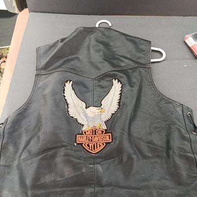 Harley Davidson Size XL Black leather biker vest with a nice collection of Sturgis pins