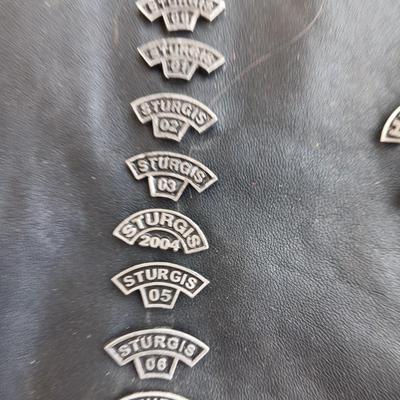 Harley Davidson Size XL Black leather biker vest with a nice collection of Sturgis pins