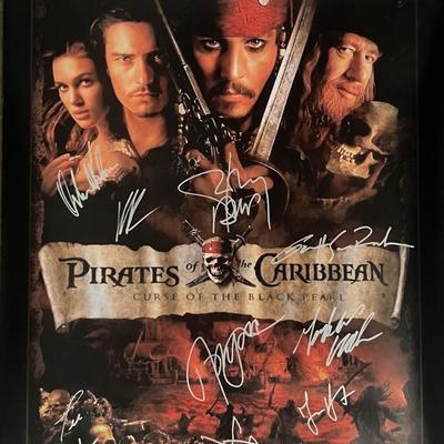 Pirates Of The Caribbean Curse Of The Black Pearl cast signed movie poster. GFA Authenticated
