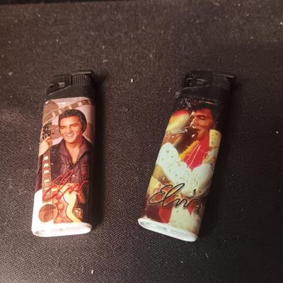 ELVIS BLVD PLASTIC SIGN, 2 DISPOSABLE LIGHTERS AND A TIN COIN BANK
