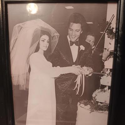 ELVIS COOK BOOK AND A FRAMED PICTURE OF ELVIS AND PRISCILLA