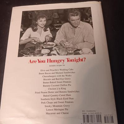 ELVIS COOK BOOK AND A FRAMED PICTURE OF ELVIS AND PRISCILLA