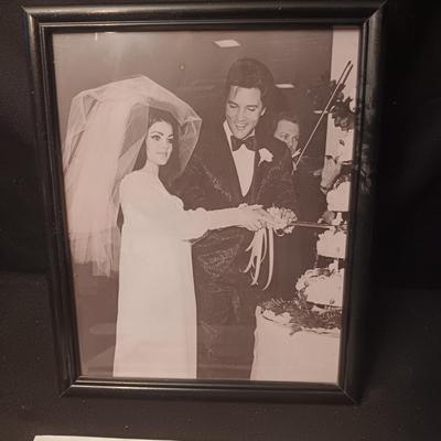 ELVIS COOK BOOK AND A FRAMED PICTURE OF ELVIS AND PRISCILLA
