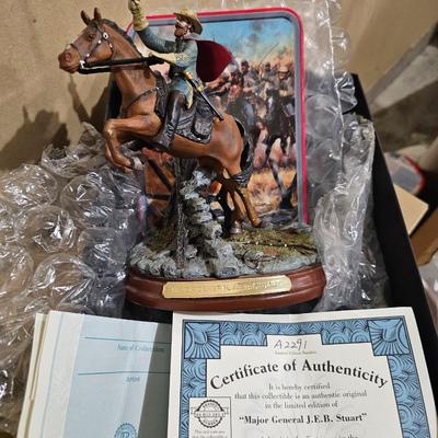 Sale Photo Thumbnail #2: HIGHLY SOUGHT AFTER AND HARD TO.FIND

This collector statue and plate display from Bradford Exchange features the portrait of Major General J.E.B. Stewart, known for his role in the American Civil War. The plate showcases a beautiful gray color that compl