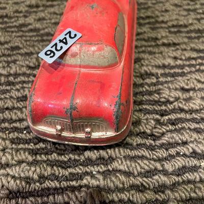 Small, red metal car
