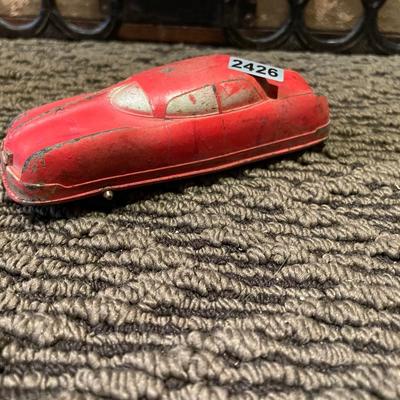 Small, red metal car
