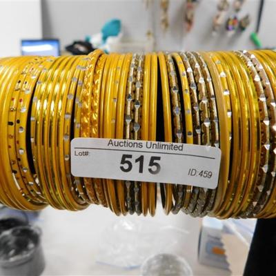 515 LOT OF 45 YELLOW GOLD BANGLE BRACELETS