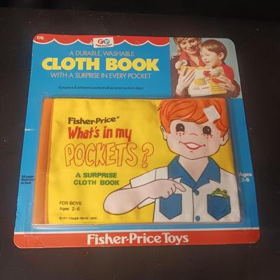 NEW FISHER-PRICE CLOTH BOOK W/A SURPRISE IN EVERY POCKET