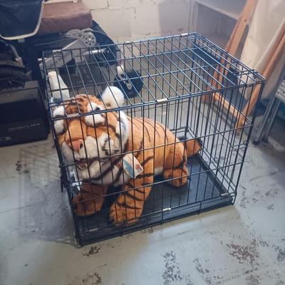 LARGE PLUSH TIGER IN A MEDIUM SIZE PETMATE KENNEL
