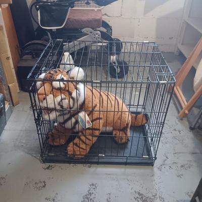 LARGE PLUSH TIGER IN A MEDIUM SIZE PETMATE KENNEL