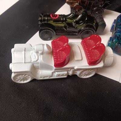 A COLLECTION OF VINTAGE AVON COLOGNE/AFTER SHAVE VEHICLES MOSTLY FULL