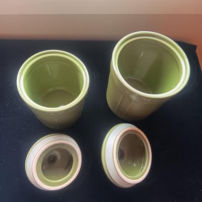 2 GREEN CANISTERS AND A MILK GLASS JUICER
