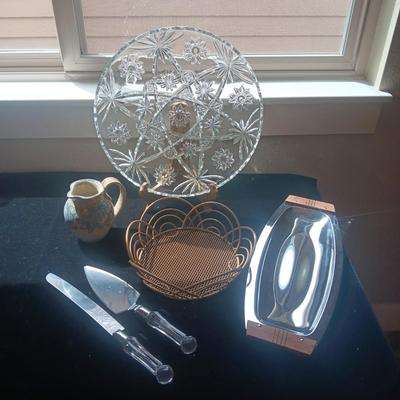 GLASS PLATTER, METAL BASKET, CLAY CREAMER, CAKE SERVING UTENSILS AND METAL SERVING TRAY