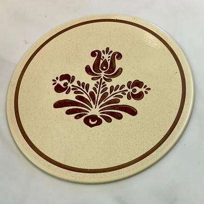 Pfaltzgraff Village pattern cake stand, has metal trivet and wooden base