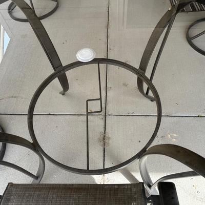 GLASS TOP PATIO TABLE WITH 4 SWIVEL CHAIRS