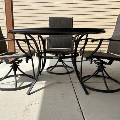 GLASS TOP PATIO TABLE WITH 4 SWIVEL CHAIRS
