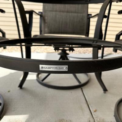 GLASS TOP PATIO TABLE WITH 4 SWIVEL CHAIRS