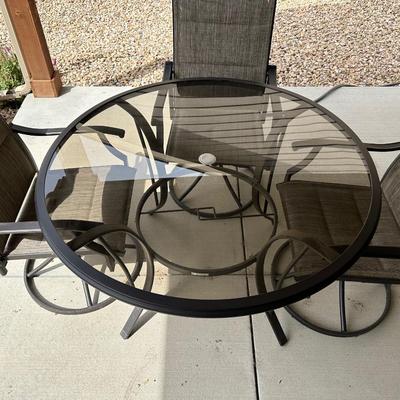 GLASS TOP PATIO TABLE WITH 4 SWIVEL CHAIRS