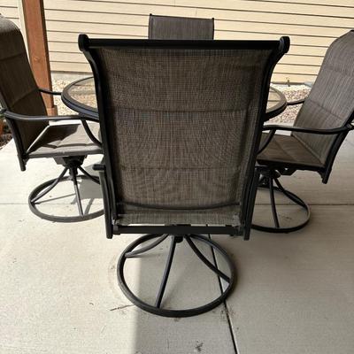 GLASS TOP PATIO TABLE WITH 4 SWIVEL CHAIRS