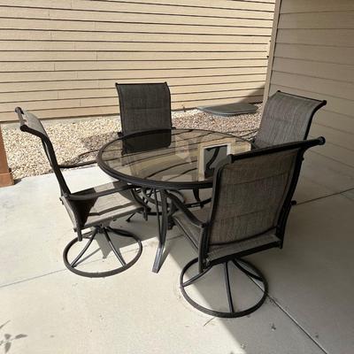 GLASS TOP PATIO TABLE WITH 4 SWIVEL CHAIRS