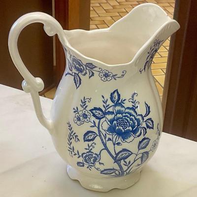 Blue and white pitcher, has small chip on lip