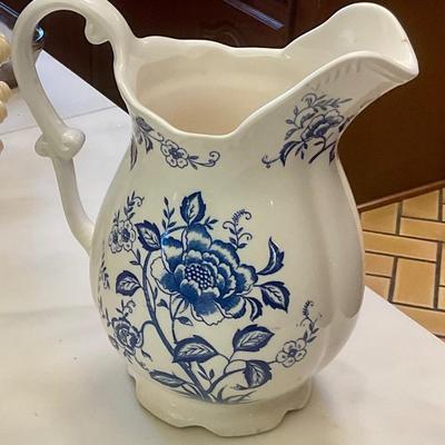 Blue and white pitcher, has small chip on lip
