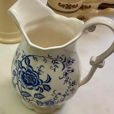 Blue and white pitcher, has small chip on lip