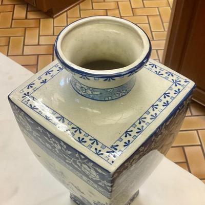 Stoke on Trent blue and white vase has hairline crack circled in picture
