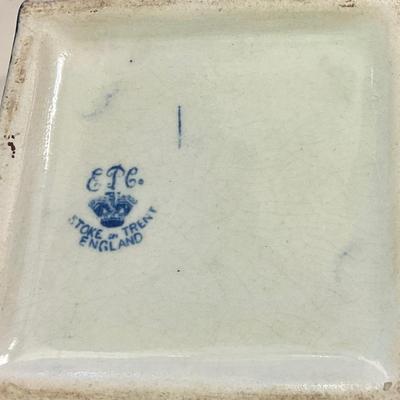 Stoke on Trent blue and white vase has hairline crack circled in picture