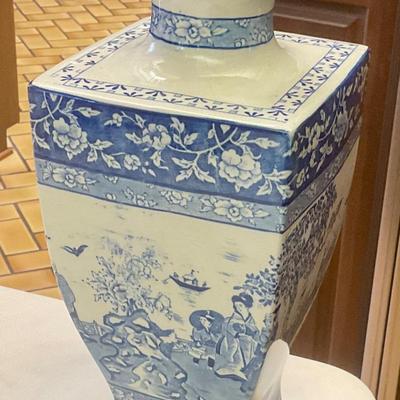 Stoke on Trent blue and white vase has hairline crack circled in picture