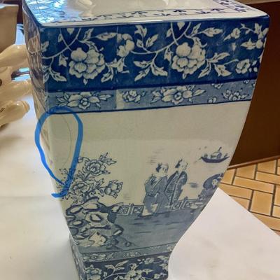 Stoke on Trent blue and white vase has hairline crack circled in picture