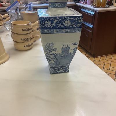 Stoke on Trent blue and white vase has hairline crack circled in picture