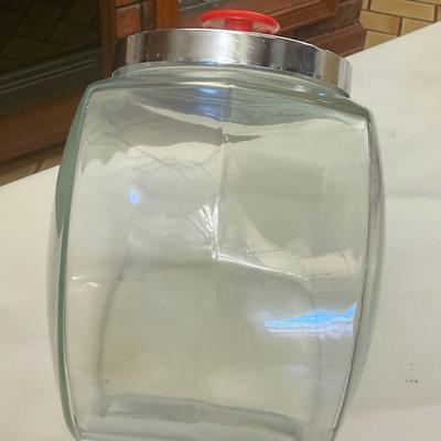 Tilted storage jar with Chrome lid and red knob