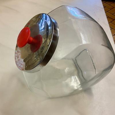 Tilted storage jar with Chrome lid and red knob