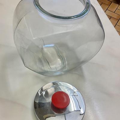 Tilted storage jar with Chrome lid and red knob
