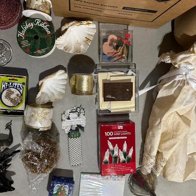 VARIETY OF CRAFTING SUPPLIES AND ROLLS OF RIBBON