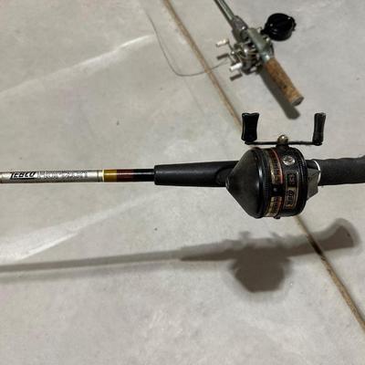 FISHING POLES WITH REELS AND A NYLON BAG