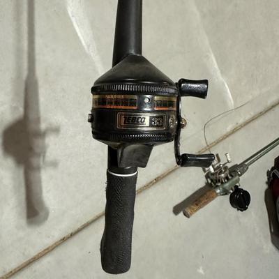 FISHING POLES WITH REELS AND A NYLON BAG