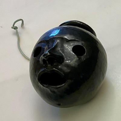 Black face pottery ashtray made in Arkansas