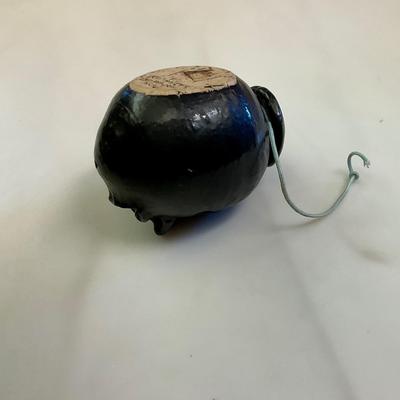 Black face pottery ashtray made in Arkansas